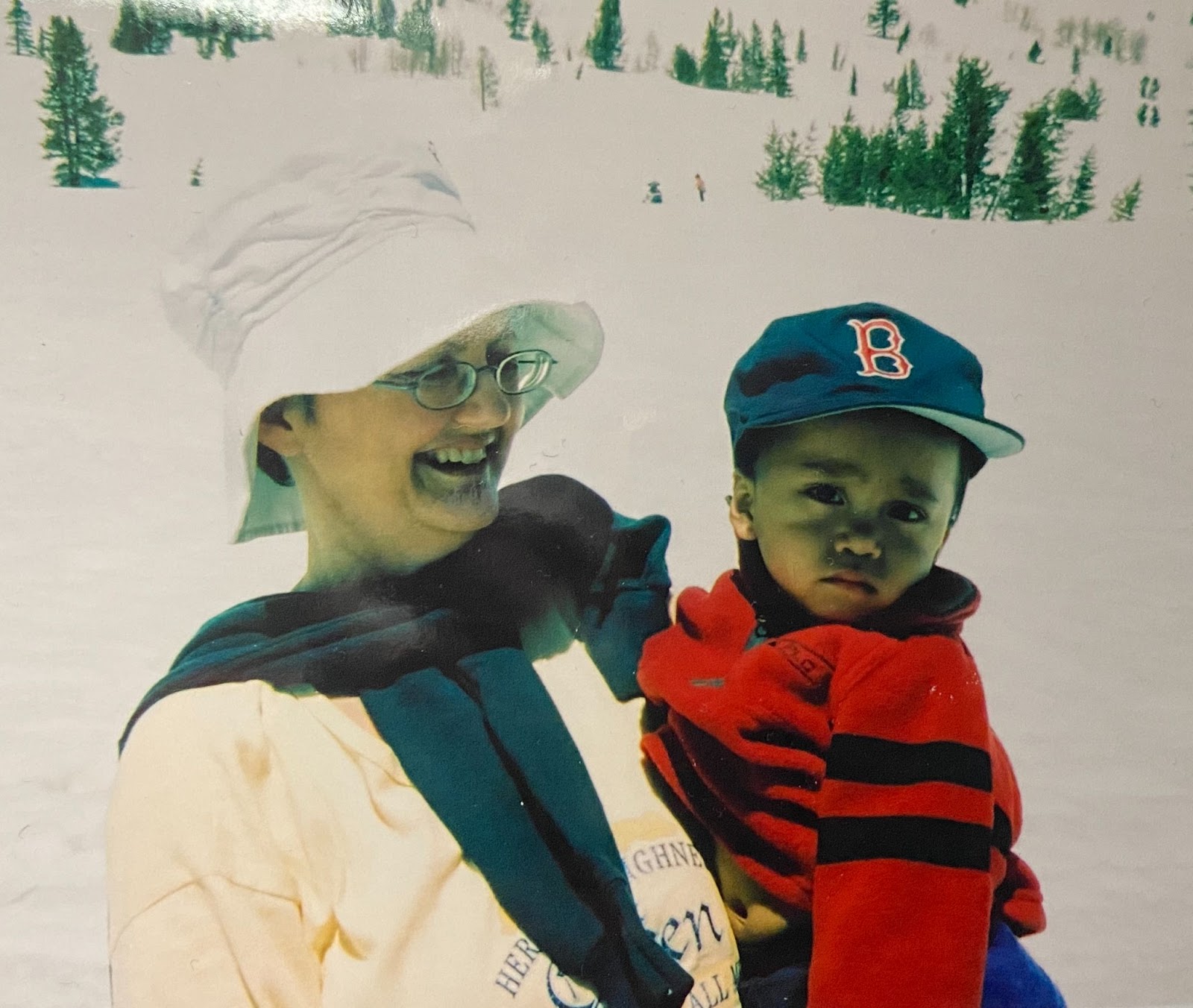 a young boy and his mom smiling for a photo